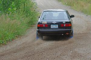 Jerry Rengo / Greg Hanka Nissan Sentra SE-R at a sharp left on SS3, Steamboat I.