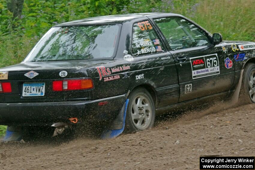 Jerry Rengo / Greg Hanka Nissan Sentra SE-R at a sharp left on SS3, Steamboat I.