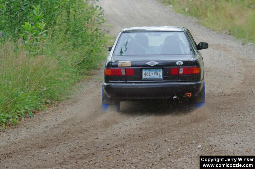 Jerry Rengo / Greg Hanka Nissan Sentra SE-R at a sharp left on SS3, Steamboat I.