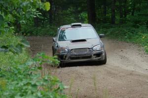 Sam Albert / Michelle Miller Subaru WRX STi at a sharp left on SS6, Steamboat II.