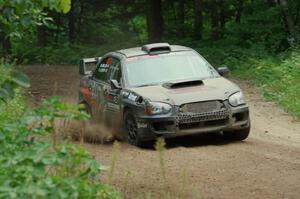 Sam Albert / Michelle Miller Subaru WRX STi at a sharp left on SS6, Steamboat II.