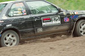 Jerry Rengo / Greg Hanka Nissan Sentra SE-R at a sharp left on SS6, Steamboat II.