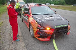 Sumit Panjabi / Nitan Jacob Mitsubishi Lancer Evo X gets readied to be towed back to Walker after rolling.