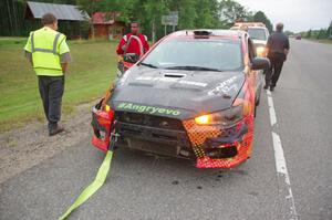 Sumit Panjabi / Nitan Jacob Mitsubishi Lancer Evo X gets readied to be towed back to Walker after rolling.