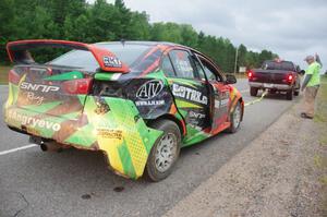 Sumit Panjabi / Nitan Jacob Mitsubishi Lancer Evo X gets readied to be towed back to Walker after rolling.