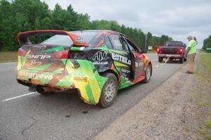 Sumit Panjabi / Nitan Jacob Mitsubishi Lancer Evo X gets readied to be towed back to Walker after rolling.