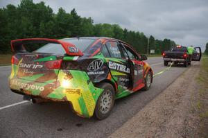 Sumit Panjabi / Nitan Jacob Mitsubishi Lancer Evo X gets readied to be towed back to Walker after rolling.