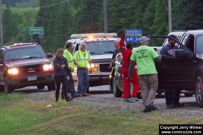 Sumit Panjabi / Nitan Jacob Mitsubishi Lancer Evo X gets readied to be towed back to Walker after rolling.