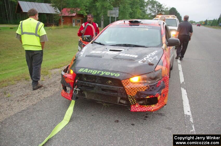 Sumit Panjabi / Nitan Jacob Mitsubishi Lancer Evo X gets readied to be towed back to Walker after rolling.