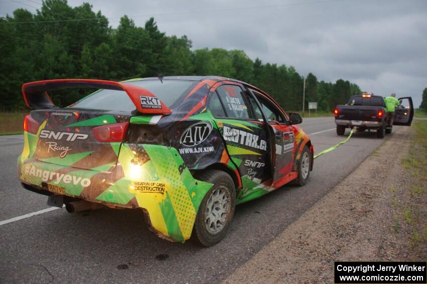 Sumit Panjabi / Nitan Jacob Mitsubishi Lancer Evo X gets readied to be towed back to Walker after rolling.