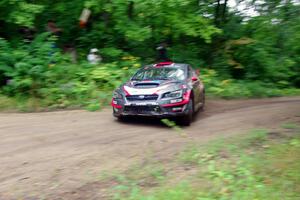 Travis Pastrana / Robbie Durant Subaru WRX STi comes through the VIP spectator corner on SS8, Perkins Road.