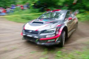 Travis Pastrana / Robbie Durant Subaru WRX STi comes through the VIP spectator corner on SS8, Perkins Road.