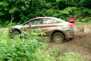 Travis Pastrana / Robbie Durant Subaru WRX STi comes through the VIP spectator corner on SS8, Perkins Road.