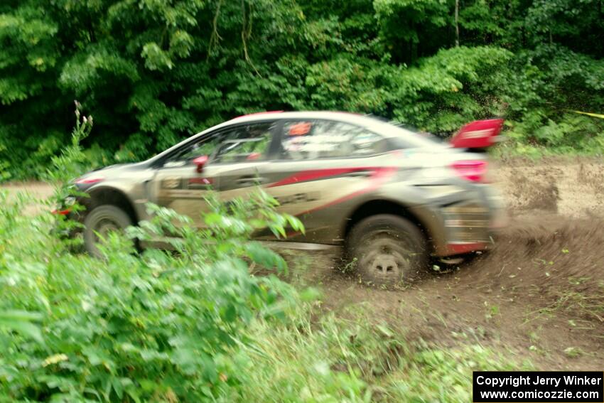 Travis Pastrana / Robbie Durant Subaru WRX STi comes through the VIP spectator corner on SS8, Perkins Road.