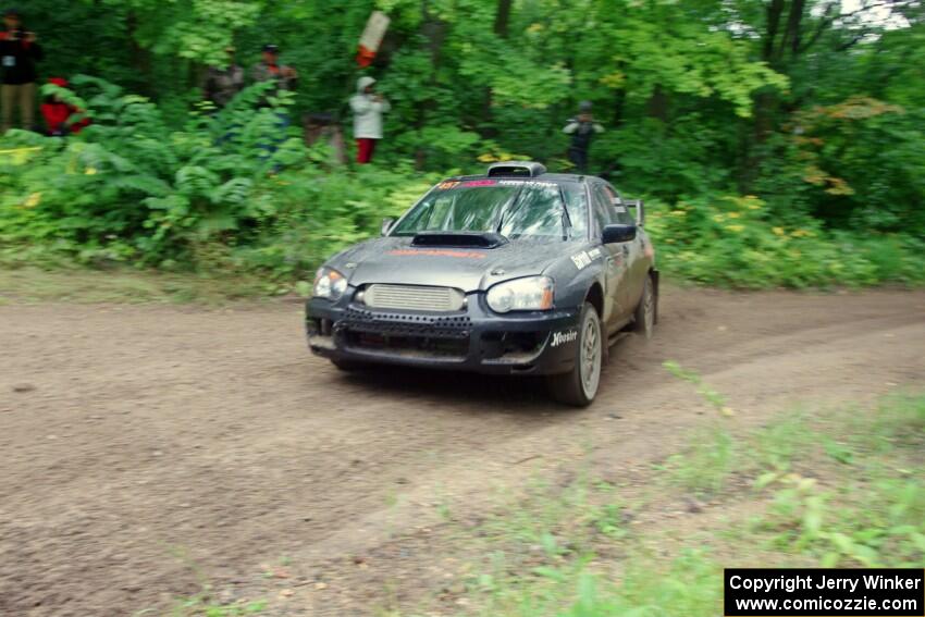 Sam Albert / Michelle Miller Subaru WRX STi comes through the VIP spectator corner on SS8, Perkins Road.