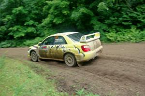 Mark Williams / Ben Peterson Subaru WRX STi comes through the VIP spectator corner on SS8, Perkins Road.