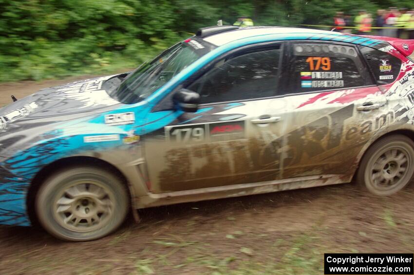 Dennis Romero / Jose Maria Rodriguez Subaru WRX STi comes through the VIP spectator corner on SS8, Perkins Road.