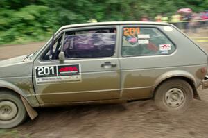 Adam VanDamme / Jake Carlson VW Rabbit comes through the VIP spectator corner on SS8, Perkins Road.