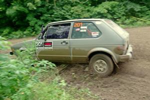 Adam VanDamme / Jake Carlson VW Rabbit comes through the VIP spectator corner on SS8, Perkins Road.