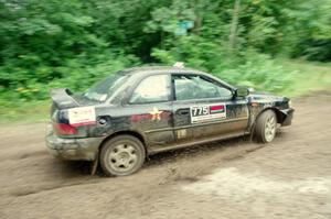 Kristian Rue / Mark Rue Subaru Impreza 2.5RS comes through the VIP spectator corner on SS8, Perkins Road.