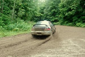 Kristian Rue / Mark Rue Subaru Impreza 2.5RS comes through the VIP spectator corner on SS8, Perkins Road.