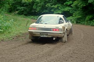 Mike Halley / Jimmy Brandt Mazda RX7 GSL-SE comes through the VIP spectator corner on SS8, Perkins Road.