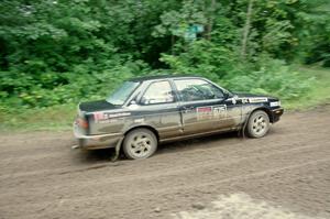 Jerry Rengo / Greg Hanka Nissan Sentra SE-R comes through the VIP spectator corner on SS8, Perkins Road.