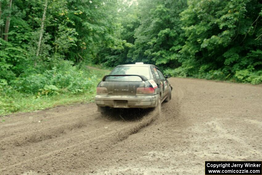 Kristian Rue / Mark Rue Subaru Impreza 2.5RS comes through the VIP spectator corner on SS8, Perkins Road.