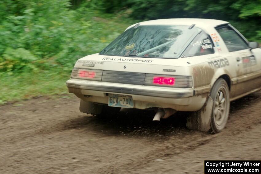 Mike Halley / Jimmy Brandt Mazda RX7 GSL-SE comes through the VIP spectator corner on SS8, Perkins Road.