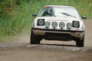 Mike Halley / Jimmy Brandt Mazda RX7 GSL-SE at speed on SS9, Sawmill Lake.