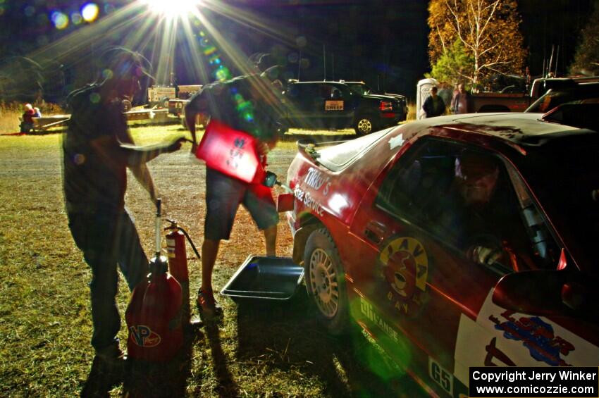 Al Dantes, Jr. / Brandon Snyder Mazda RX-7 Turbo is refueled before leaving Sidnaw service.