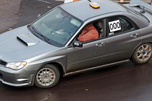 Car 000, a Subaru WRX, clears the course.