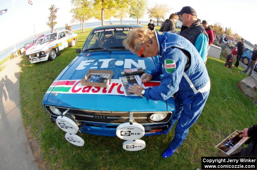 Hannu Mikkola signs autographs.