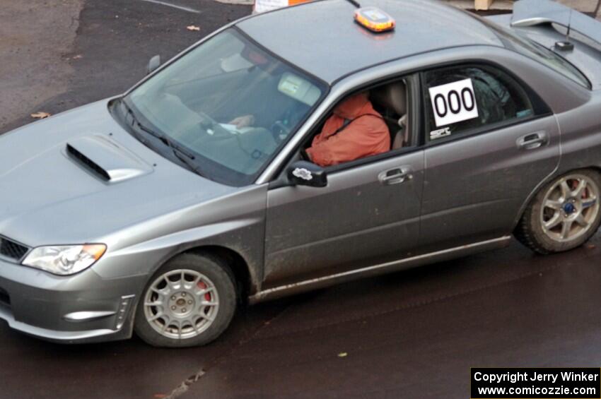 Car 000, a Subaru WRX, clears the course.