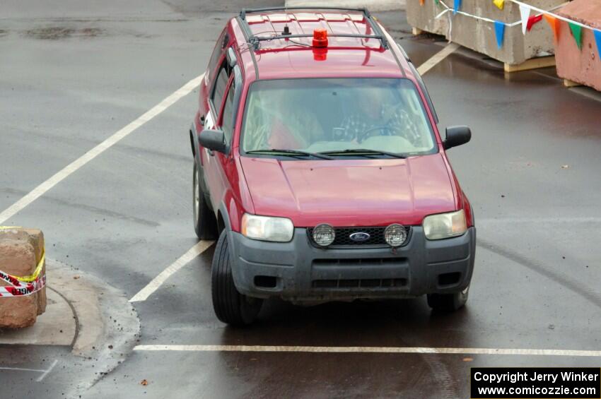 Car 00, a Ford Escape, clears the course.