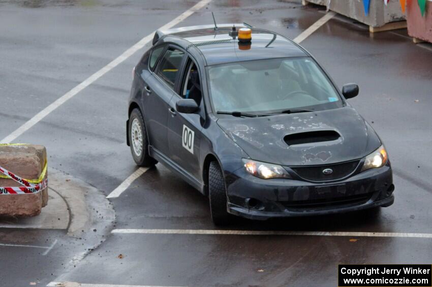 Car 0, a Subaru Impreza, clears the course.