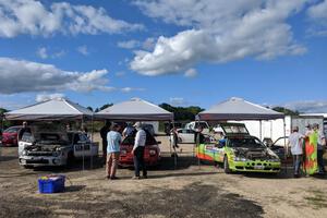 Three cars prep before the rally.