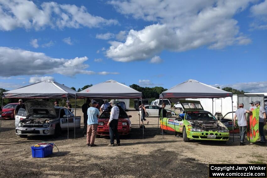 Three cars prep before the rally.