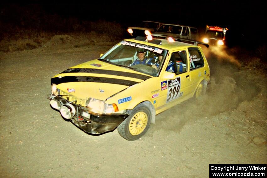 Andrew Grady / Bill Culbertson Toyota Corolla FX-16 gets back on the road in front of sweep on SS1, Mayer South.