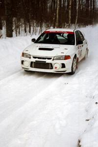 Tim Paterson / Scott Ferguson Mitsubishi Lancer Evo IV at speed on SS1, Hardwood Hills Rd.