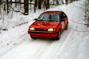 Gail Truess / Pattie Hughes-Mayer Mazda 323GTX at speed on SS1, Hardwood Hills Rd.