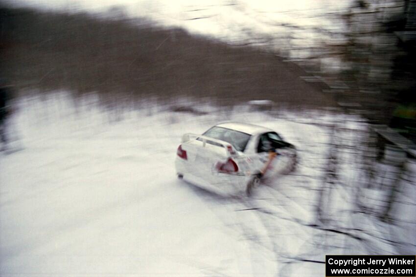 Pete Lahm / Matt Chester Mitsubishi Lancer Evo IV at speed on SS1, Hardwood Hills Rd.