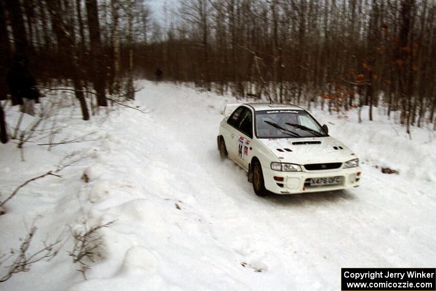 Karl Scheible / Brian Maxwell Subaru WRX STi at speed on SS4, Avery Lake.