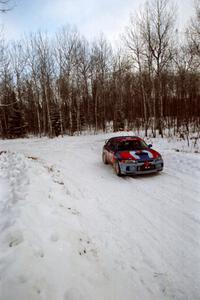 Alec Ellsworth / Steve Kaczkowski Mitsubishi Lancer Evo IV at a sharp corner on SS1, Hardwood Hills Rd.