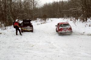 Matthew Johnson / Eric Adams VW GTI passes the stranded Dennis Martin / Chris Plante Mitsubishi Eclipse GSX on SS1.