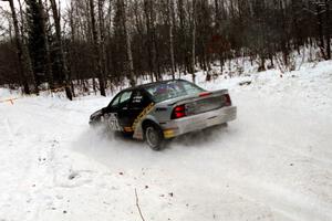 Anthony Grinnell / Kim Young Chevy Beretta goes straight off at a sharp corner on SS1, Hardwood Hills Rd.