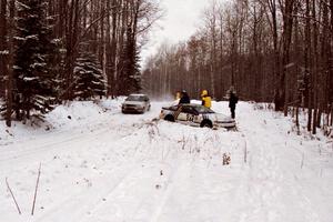 Dan Malott / Matt Malott Eagle Talon gets stuck on SS4, Avery Lake , as Russ Rosendale / Robin Winter VW Golf passes by.