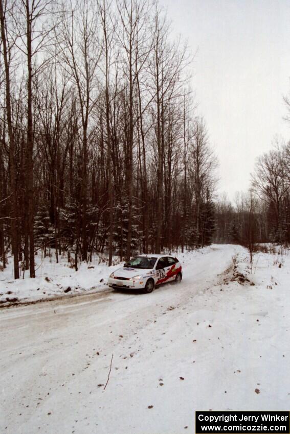 Ken Kovach / Dave Bruce Ford Focus sets up for a sharp corner on SS1, Hardwood Hills Rd.