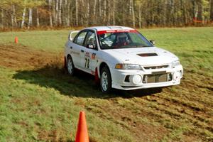 Paul Dunn / Rebecca Dunn Mitsubishi Lancer Evo IV at the midpoint water crossing on SS2, Herman.