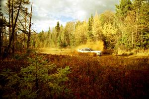 Seamus Burke / Frank Cunningham Mitsubishi Lancer Evo VI at the midpoint water crossing on SS2, Herman.